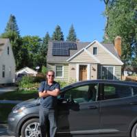 Professor Roy Cole in front of his home